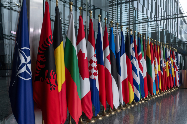 BRUSSELS, BELGIUM - FEBRUARY 12: Flags of NATO member states stand outside NATO headquarters on February 12, 2026 in Brussels, Belgium. Ukrainian Defence Minister Mykhailo Fedorov held a series of bilateral meetings with partners in Brussels, where he spoke about his priorities as Defence Minister and projects for mutually beneficial cooperation. According to Mykhailo Fedorov, Ukraine considers the Prioritized Ukraine Requirements List (PURL) mechanism as the main way to deliver urgently needed missiles to Ukraine during ongoing Russia's full-scale war against Ukraine. (Photo by Viktor Fridshon/Global Images Ukraine via Getty Images)