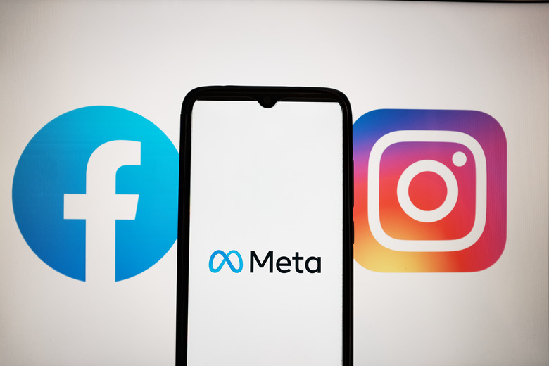 In this photo illustration a Meta logo seen displayed on a smartphone screen with Facebook and Instagram logos on a MacBook screen in Athens, Greece on April 28, 2023. (Photo illustration by Nikolas Kokovlis/NurPhoto via Getty Images)