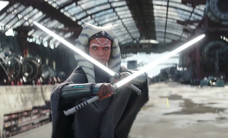 Ahsoka holds two lightsabers.