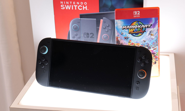 The Nintendo Switch 2 next to a copy of Mario Kart World.