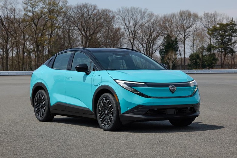 Promo image of a bright blue 2026 Nissan Leaf EV on a road.