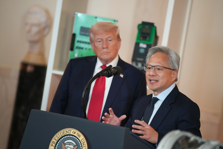 WASHINGTON, DC - APRIL 30: U.S. President Donald Trump (L) listens as Nvidia CEO Jensen Huang speaks in the Cross Hall of the White House during an event on 