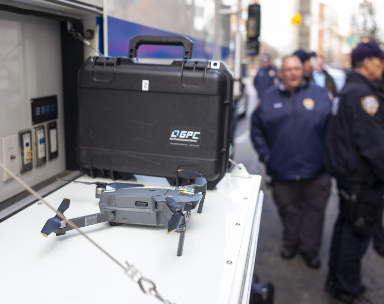 BROOKLYN, NEW YORK - MARCH 19: New York Police Department's Deputy Chief, Robert Lukach, extreme right, speaks to members of the media following a five-hour standoff inside an apartment building in Brooklyn, New York on March 19, 2019. A Mavic drone (center left) was used to see inside the 8th floor apartment. A mentally unstable man holding a fake plastic pistol was taken into custody by a NYPD special hostage team police officer. (Photo by Robert Nickelsberg/Getty Images)