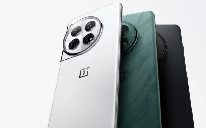 A trio of OnePlus 12 phones in different colors.
