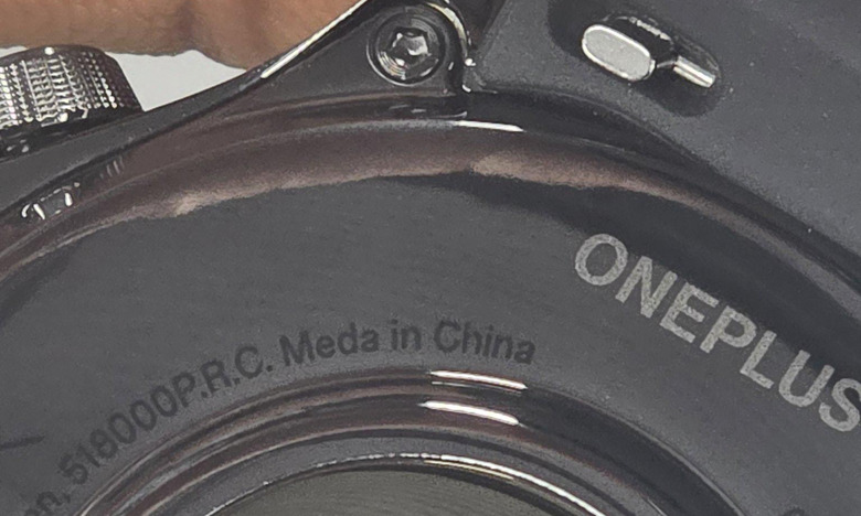 Closeup of the back of a OnePlus Watch 3 with the text 