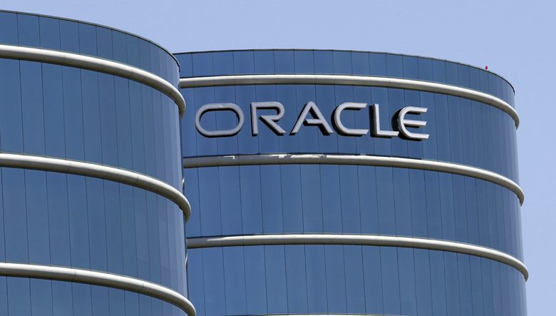 FILE - This June 18, 2012, file photo shows Oracle headquarters in Redwood City, Calif. The Labor Department is suing Oracle, claiming that the technology giant pays white male workers more than their non-white and female counterparts with the same job titles. In a statement issued Wednesday, Jan. 18, 2017, Oracle called the lawsuit 