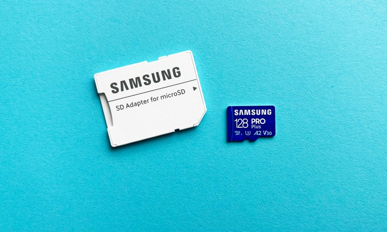 The Samsung Pro Plus microSD card and its accompanying SD adapter sit against a teal background.