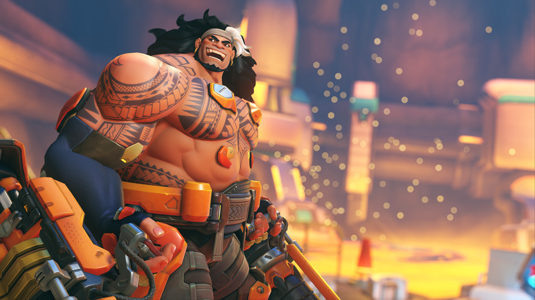 A large animated man covered in Samoan tattoos smiles broadly as he holds two enormous guns. In the background is the center of a volcano.