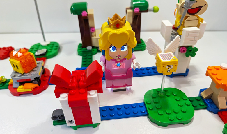 An overhead view of pieces from the Lego Super Mario Bros. Peach set, laid out and interconnected.