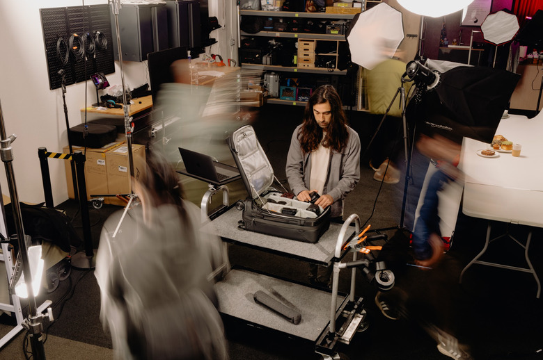 A guy packing a bag.