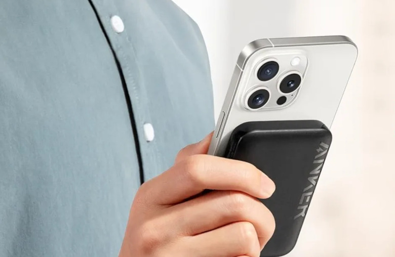 A hand holding a phone.