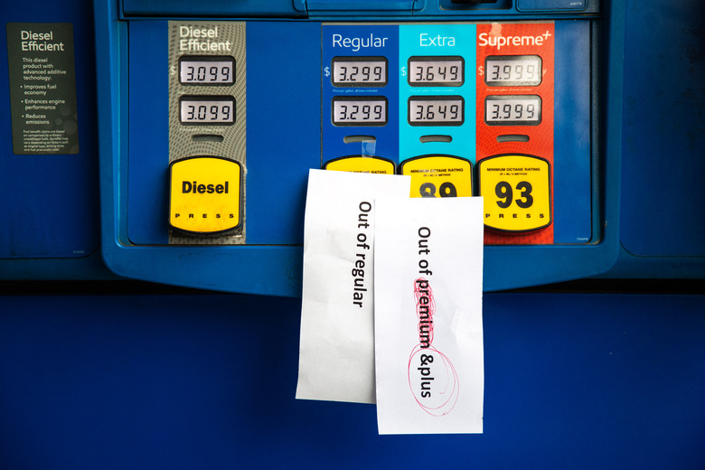 Notes are left on gas pumps to let motorists know the pumps are empty at an Exxon gas station in Charlotte, North Carolina on May 12, 2021. - Fears the shutdown of the Colonial Pipeline because of a cyberattack would cause a gasoline shortage led to some panic buying and prompted US regulators on May 11, 2021 to temporarily suspend clean fuel requirements in three eastern states and the nation's capital. (Photo by Logan Cyrus / AFP) (Photo by LOGAN CYRUS/AFP via Getty Images)