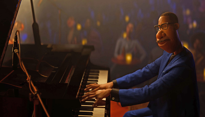 A man sits at a piano in a jazz club in Pixar's Soul.