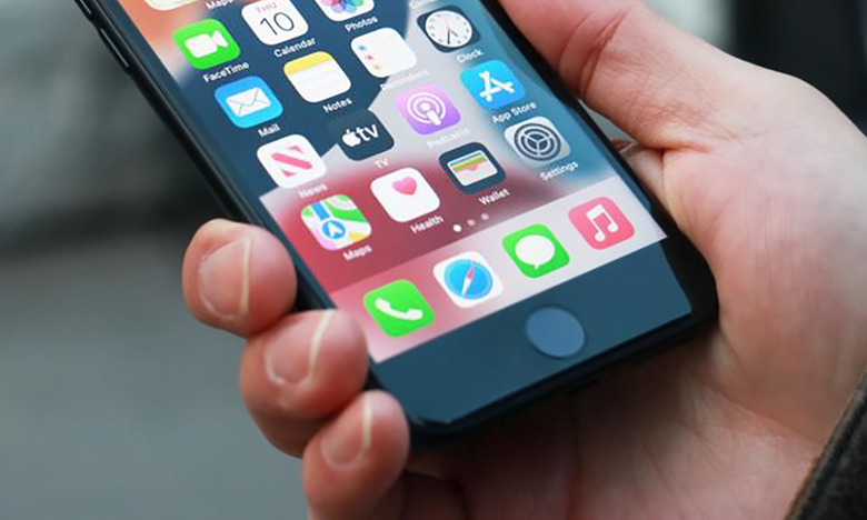 A closeup of the iPhone SE (2022) in hand.