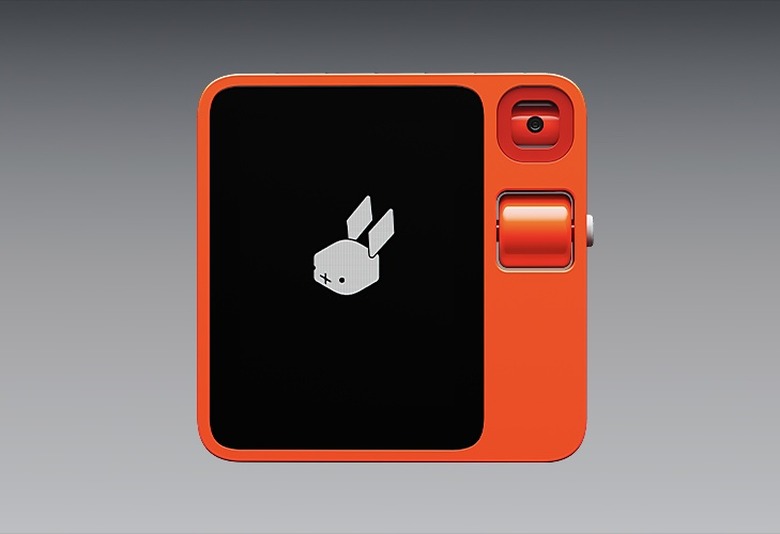 Rabbit R1 device against a gray background