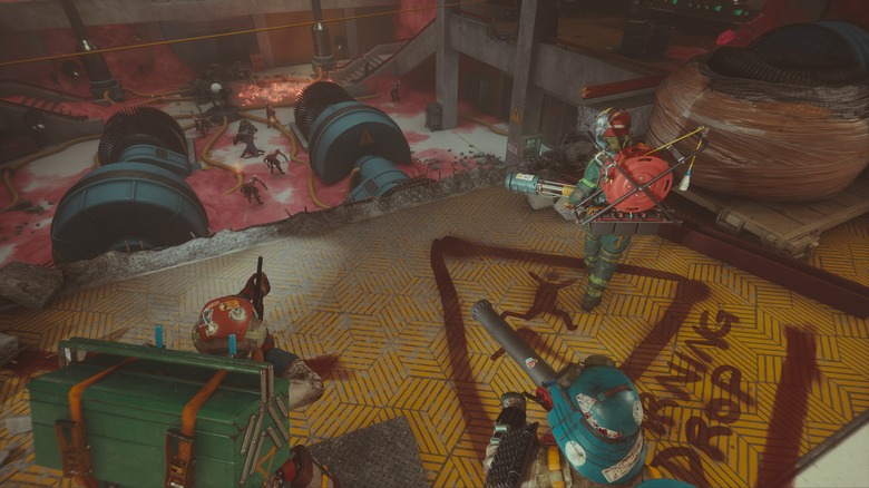 Three player looking down on approaching enemies from FBC: Firebreak.