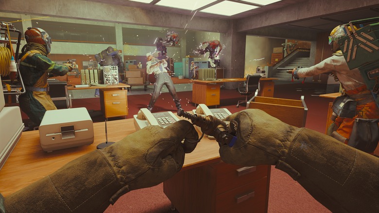 Three players attacking enemies in an office in FBC: Firebreak.