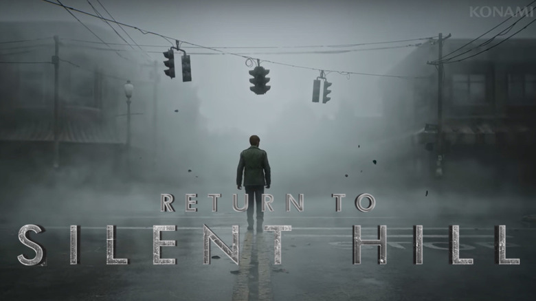 View from behind of a person walking through a foggy town. 