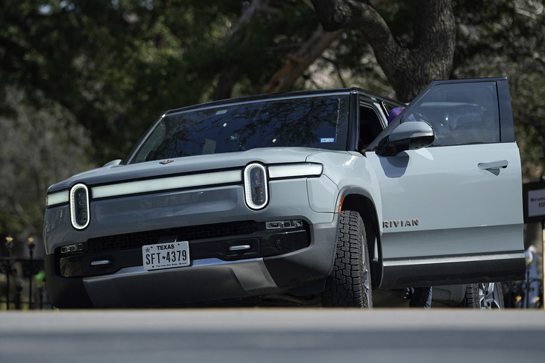 FILE - A Rivian sport-utility vehicle is seen on display in Austin, Texas, Feb. 22, 2023. Rivian reports results on Wednesday, Feb. 21, 2024. (AP Photo/Eric Gay, File)