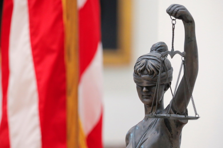 A Lady Justice statue is seen at the Delaware Supreme Court in Dover, Delaware, U.S., June 10, 2021. REUTERS/Andrew Kelly