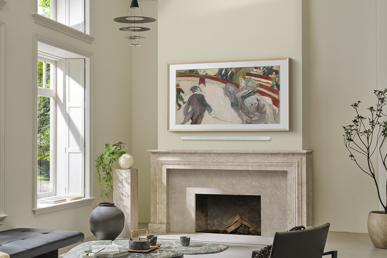 A the Frame Pro TV hanging over a mantelpiece. 