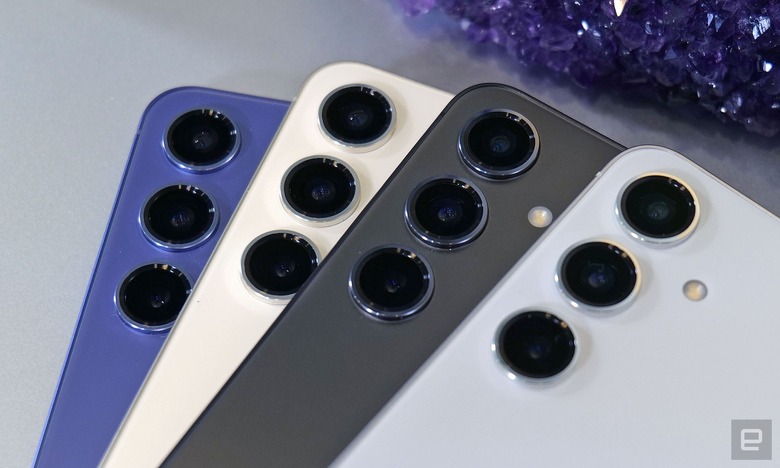 Four colors of the Samsung Galaxy S24 are arrayed on a gray surface. 