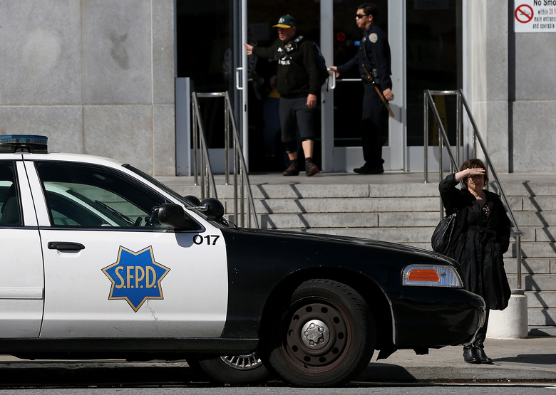 SAN FRANCISCO, CA - FEBRUARY 27:  A San Francisco police car sits parked in front of the Hall of Justice on February 27, 2014 in San Francisco, California.  A federal grand jury has indicted five San Francisco police officers and one former officer in two cases involving drug and computer thefts from suspects and the theft of money and gift cards from suspects. (Photo by Justin Sullivan/Getty Images)