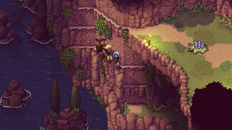 Three party members hanging on a cliff. 
