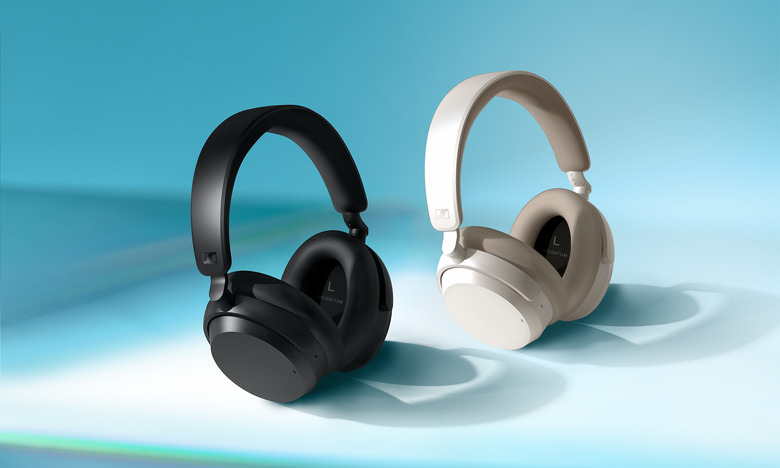 Product marketing photo for the Sennheiser Accentum Wireless. Two headphone pairs (one in black, the other in white) on a light blue surface with dynamic lighting and shadows.