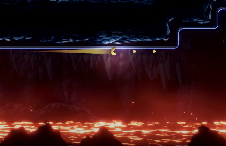 He be rolling above lava eating dots.