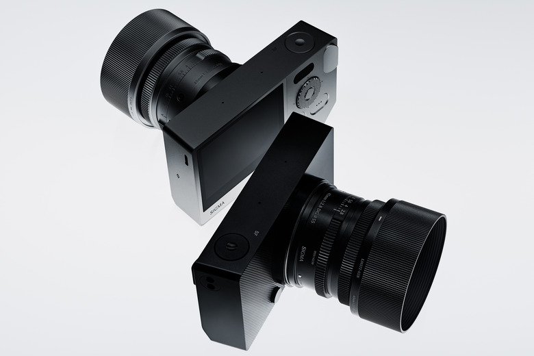 Two Sigma BF cameras with lenses attached.