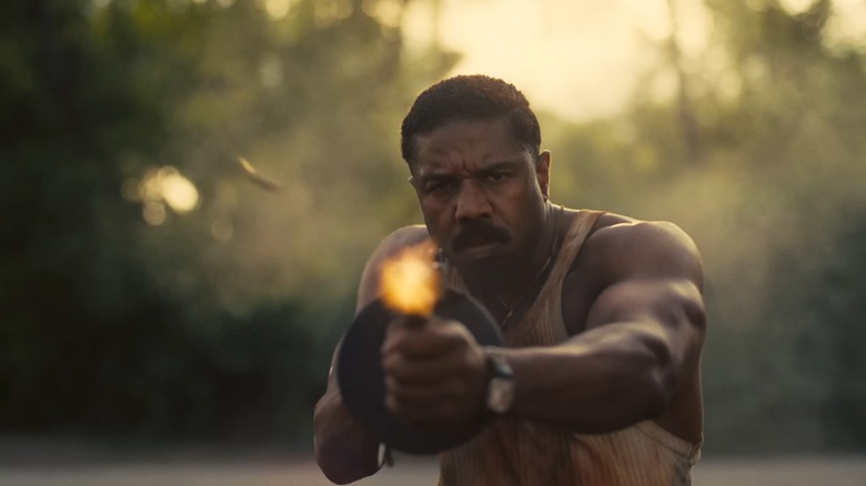Micheal B. Jordan shooting a tommy gun from the Sinners trailer.