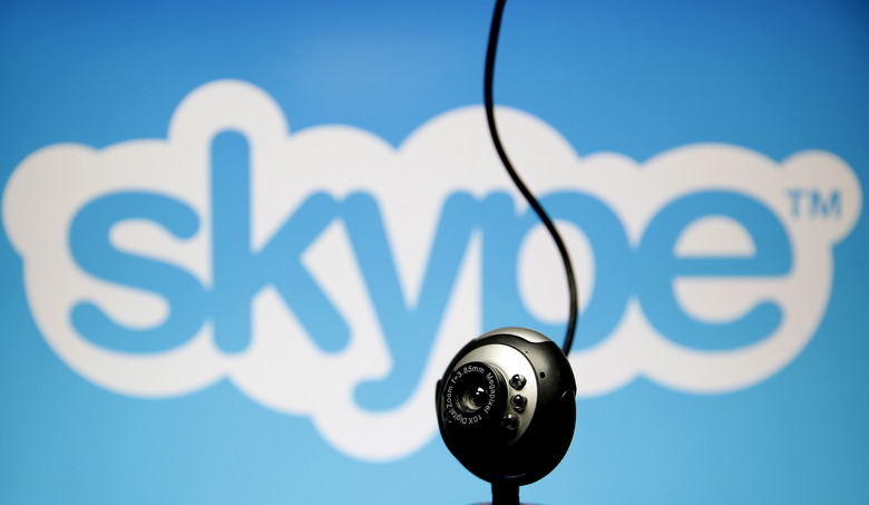A web camera is seen in front of a Skype logo in this photo illustration taken in Zenica, May 26, 2015. Online communication service Skype has been summoned to appear in court in Belgium after refusing to pass on customer data to aid a criminal investigation, a court spokesman said. A court in Mechelen, just north of Brussels, had asked for data from messages and calls exchanged on Microsoft-owned Skype, arguing that telecom operators in the country were required to do so. REUTERS/Dado Ruvic