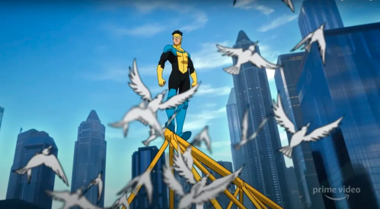 Invincible standing on a bridge.
