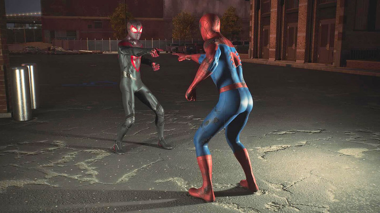 An image of one digitally rendered Spider-Man pointing at another one with a darker suit color. Both are standing in a dark alley below a bright overhead light.