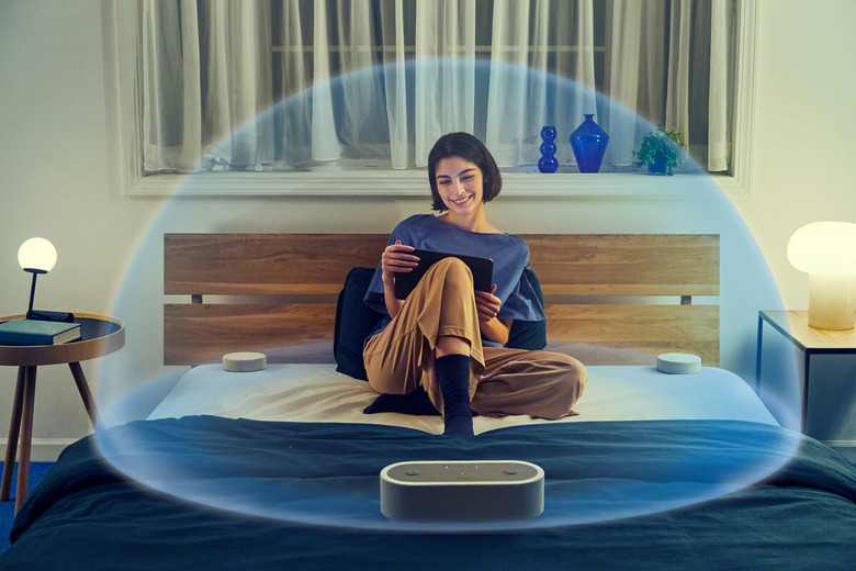 A lady in a bubble of sound created by Sony speakers. 