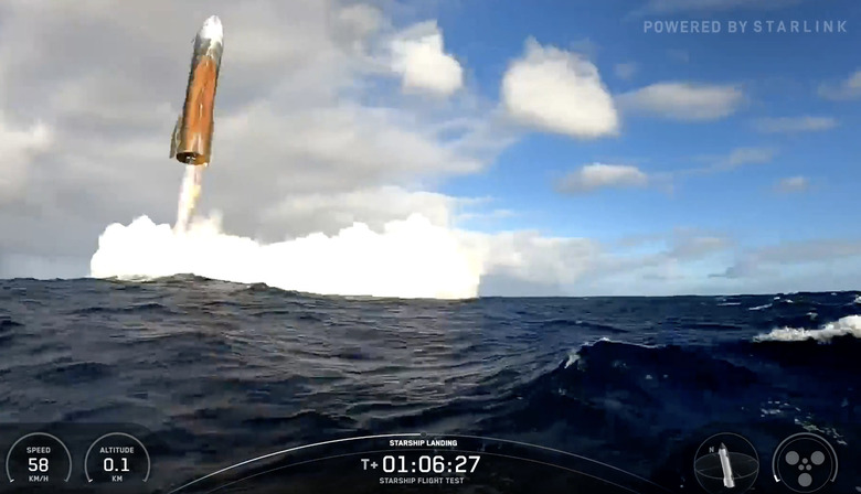 A rocket splashing down into the ocean.