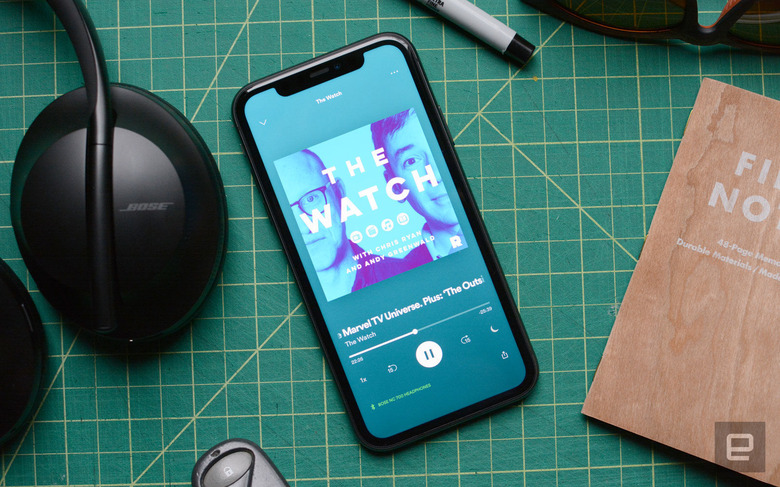 A pic showing a phone with a podcast queued up on Spotify.