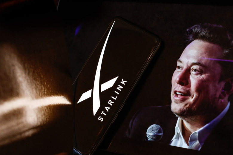 LONDON, UNITED KINGDOM - 2024/07/02: In this photo illustration, the Starlink logo is displayed on a smartphone screen and a computer screen displaying a portrait of Elon Musk, who is the owner of Starlink. The company recently introduced Starlink Mini. (Photo Illustration by Dominika Zarzycka/SOPA Images/LightRocket via Getty Images)