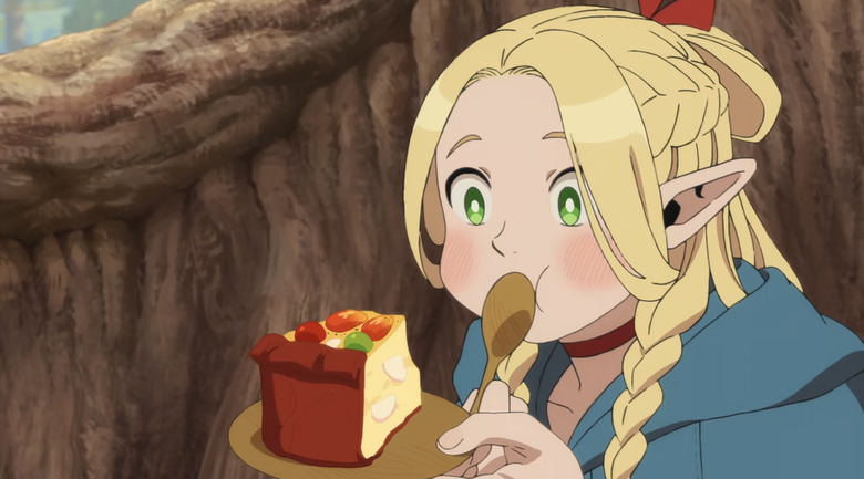 A still from the show delicious in dungeon showing the character Marcille eating a slice of food