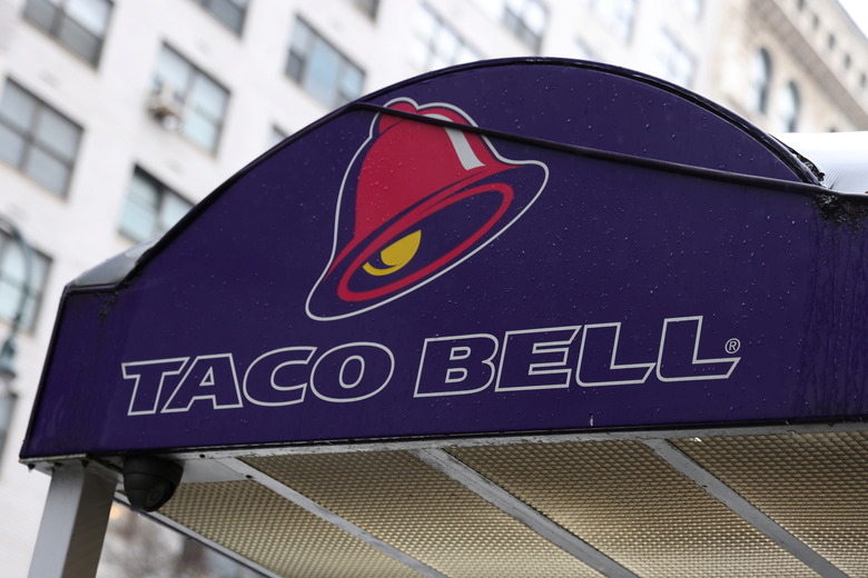 The logo of Taco Bell, a subsidiary of Yum! Brands, Inc. is seen on a store in Manhattan, New York City, U.S., February 7, 2022. REUTERS/Andrew Kelly