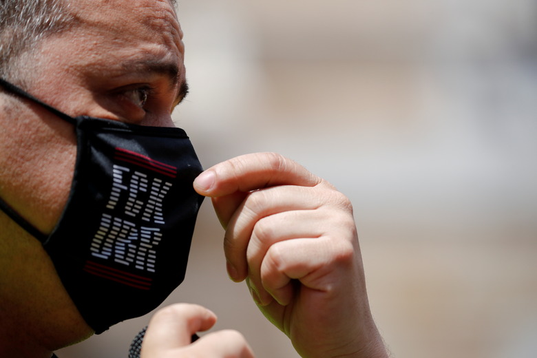 Taxi driver and union member Tito Alvarez adjusts his mask as he attends a protest against the regulation of VTC cars (Uber and Cabify) in Barcelona, Spain, May 20, 2021. REUTERS/Albert Gea