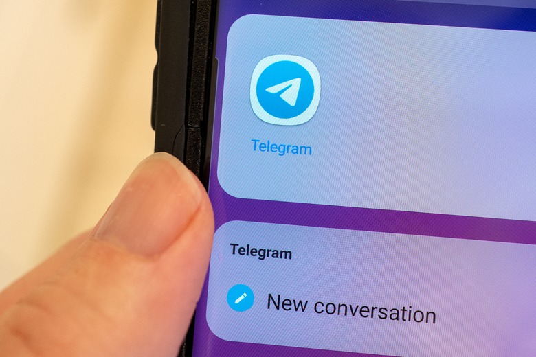 Close-up of human hand holding a cellphone displaying icon for the Telegram communications app, Lafayette, California, September 22, 2021. (Photo by Smith Collection/Gado/Getty Images)