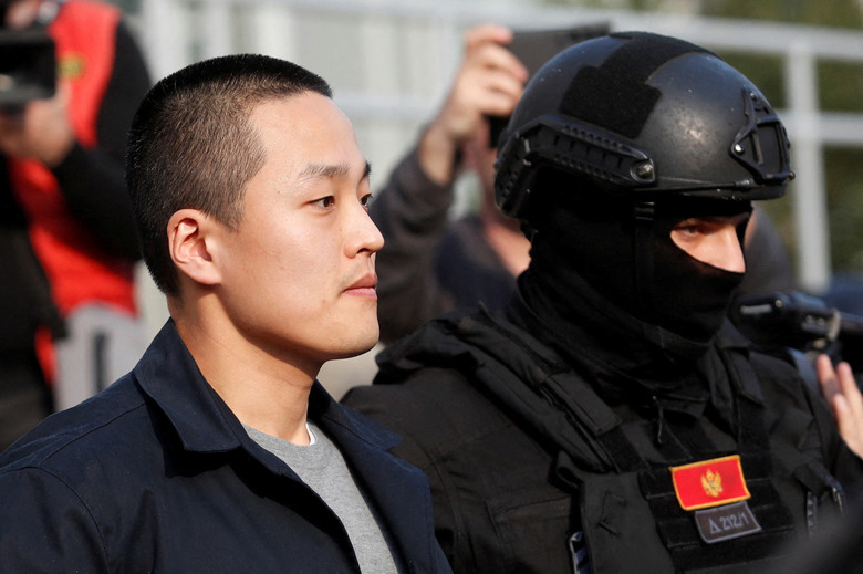 FILE PHOTO: Police officers escort Terraform Labs co-founder Do Kwon after he served a sentence for document forgery, in Podgorica, Montenegro, March 23, 2024. REUTERS/Stevo Vasiljevic/File Photo