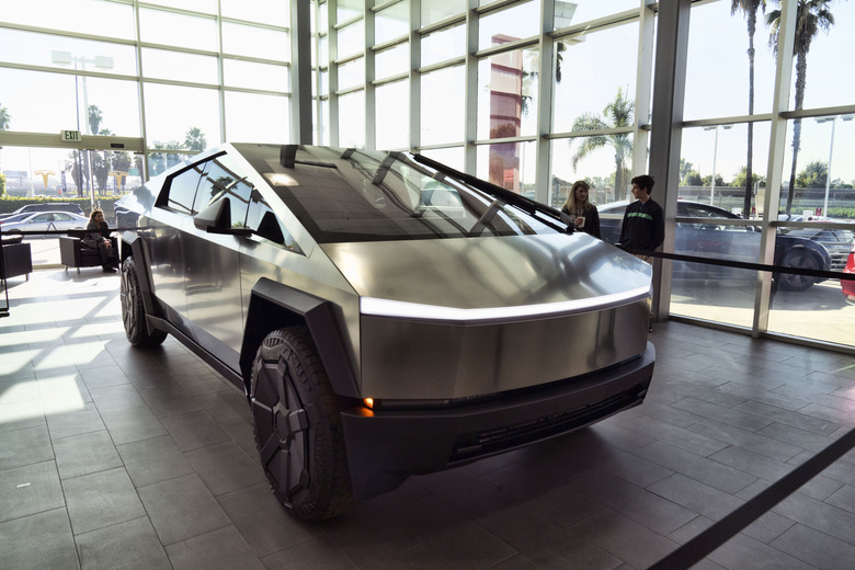 A Tesla Cybertruck is on display at the Tesla showroom in Buena Park, Calif. on Sunday Dec. 3, 2023. With manufacturing kinks still to be worked out, Tesla has delivered the first dozen or so of its futuristic Cybertruck pickups to customers. (AP Photo/Richard Vogel)