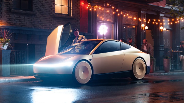 A man getting into a Cybercab on the street.