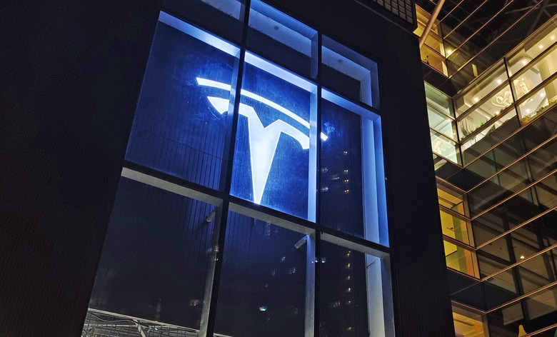 SHANGHAI, CHINA - SEPTEMBER 28, 2022 - A night view of a Tesla store for new energy electric vehicles is seen in Shanghai, China, Sept 28, 2022. September 28, 2022 - Market expectations data show that new energy electric vehicle Tesla will deliver around 350,000 to 370,000 units in the third quarter, which will break the quarterly record of 310,000 units delivered in the first quarter of 2022. In addition, Tesla's Shanghai Gigafactory, which mass-produces the Model 3 and Model Y, the two best-selling models, has surpassed the factory in Fremont, California, making it the company's most productive factory. (Photo credit should read CFOTO/Future Publishing via Getty Images)