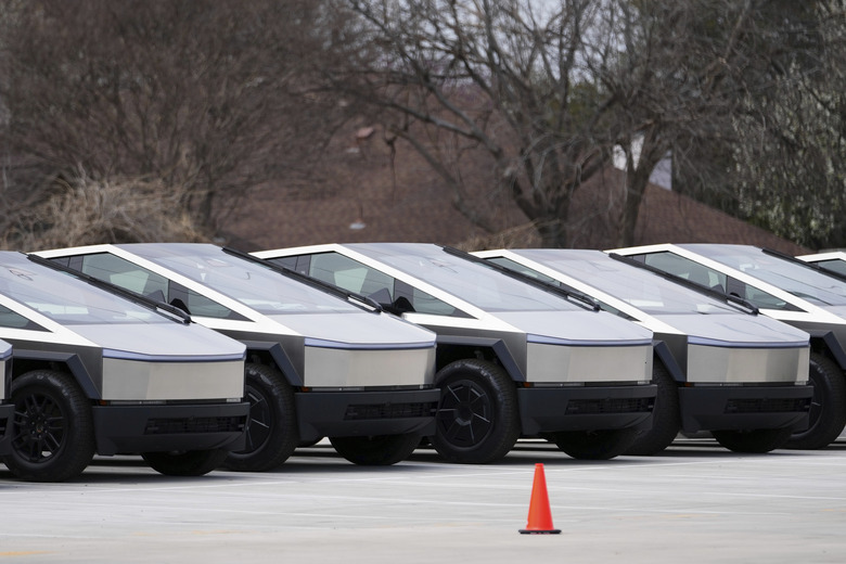 Tesla Cybertrucks are seen parked at a dealership Wednesday, March 12, 2025, in Plano, Texas. (AP Photo/Julio Cortez)