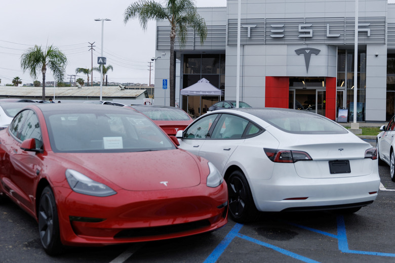 Tesla Model 3 vehicles are shown for sale at a Tesla facility in Long Beach, California, U.S., May 22, 2023. REUTERS/Mike Blake