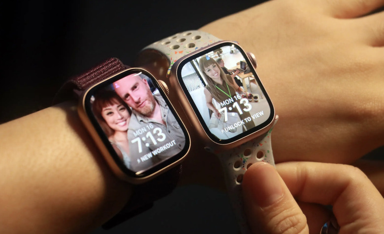 Two smartwatches on a wrist.